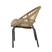 Set of two Noble House outdoor accent chairs with curved backs and basket frames in light brown and beige.