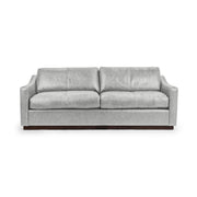 Classic Home Aspen stationary sofa with plush cushions and elegant upholstery, showcasing a modern living room setup.