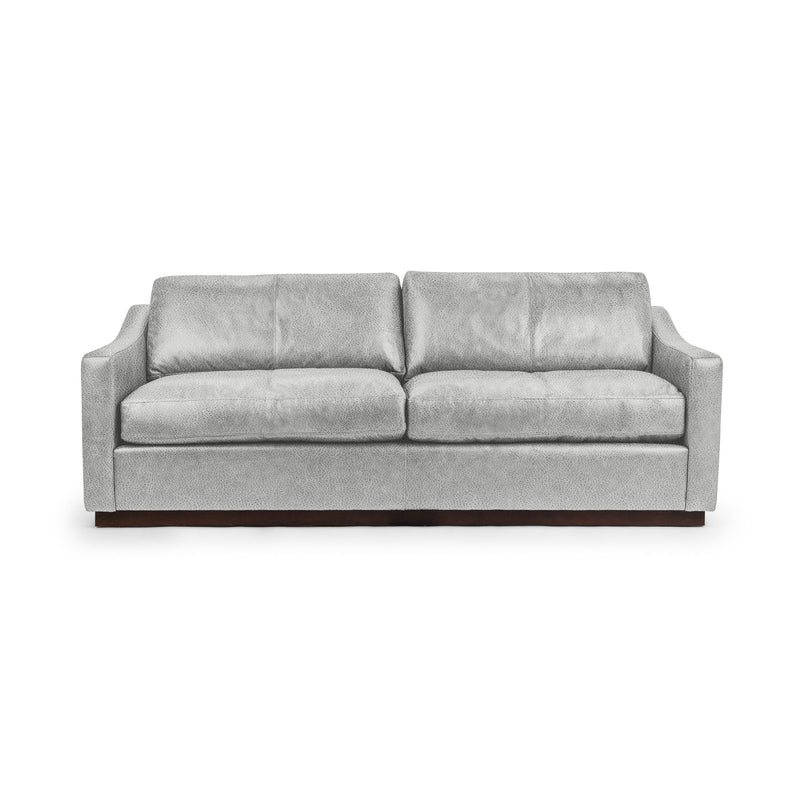Classic Home Aspen stationary sofa with plush cushions and elegant upholstery, showcasing a modern living room setup.
