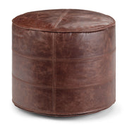 Handcrafted round accent pouf by Simpli-Home featuring a soft fabric cover and plush cushioning, perfect for living room decor.