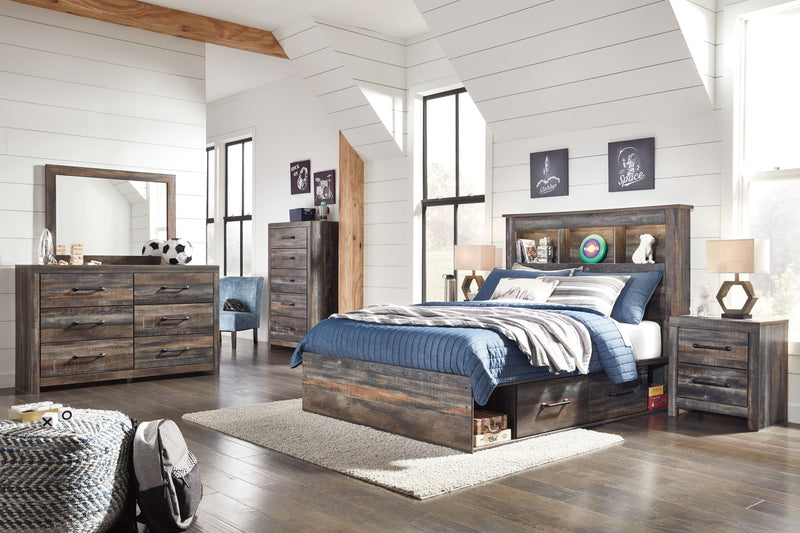 Signature Design by Ashley Drystan bookcase bed with storage, part of an 8-piece bedroom set, featuring a modern wood finish and built-in shelves.