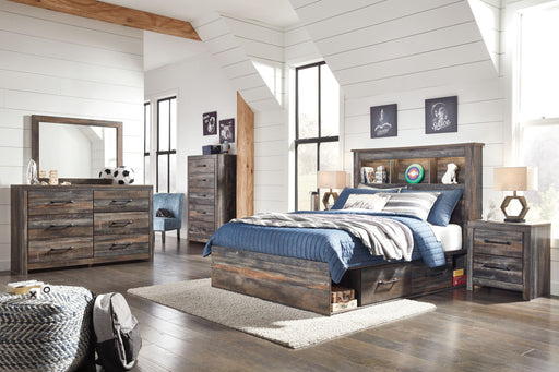 Signature Design by Ashley Drystan bookcase bed with storage, part of an 8-piece bedroom set, featuring a modern wood finish and built-in shelves.