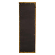 Uttermost Vilmos metallic gold wall mirror with a sleek, modern frame reflecting light and adding elegance to interior decor.