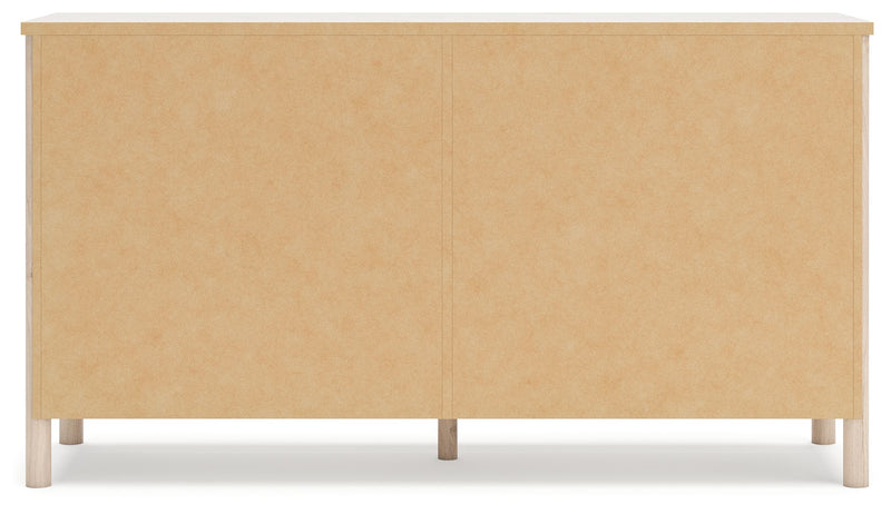 Signature Design by Ashley Cadmori six drawer dresser with sleek wood finish and modern hardware, showcasing ample storage space.