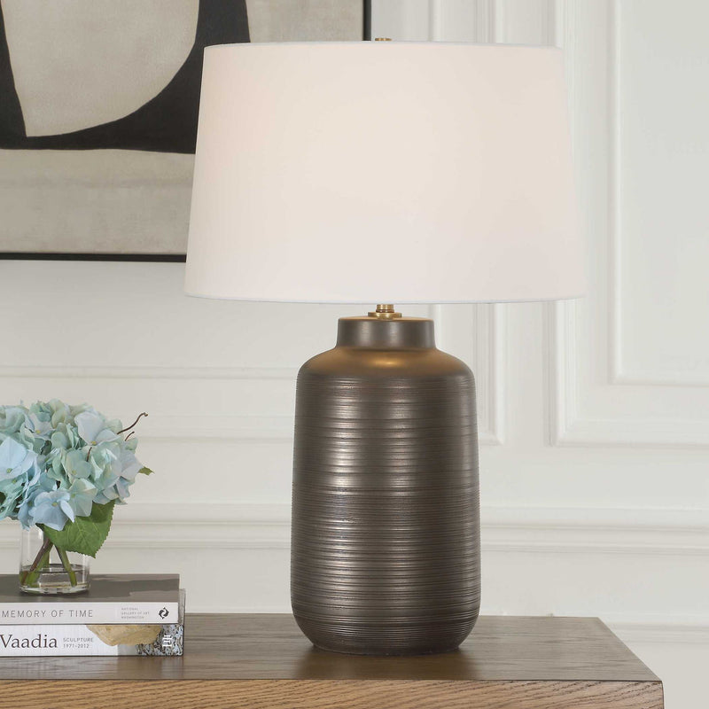 Uttermost Calderone bronze table lamp with a sleek, modern design and a sturdy base, ideal for contemporary home decor.