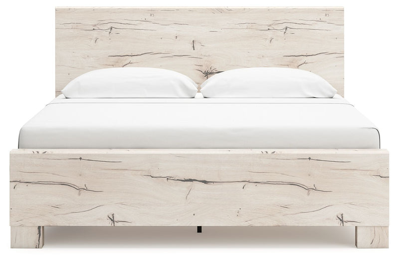 Signature Design by Ashley Lawroy panel bed with built-in storage drawers in a modern bedroom setting.