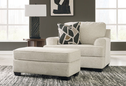 Benchcraft® Heartcort living room set with stationary chair and matching ottoman in a cozy, modern design.
