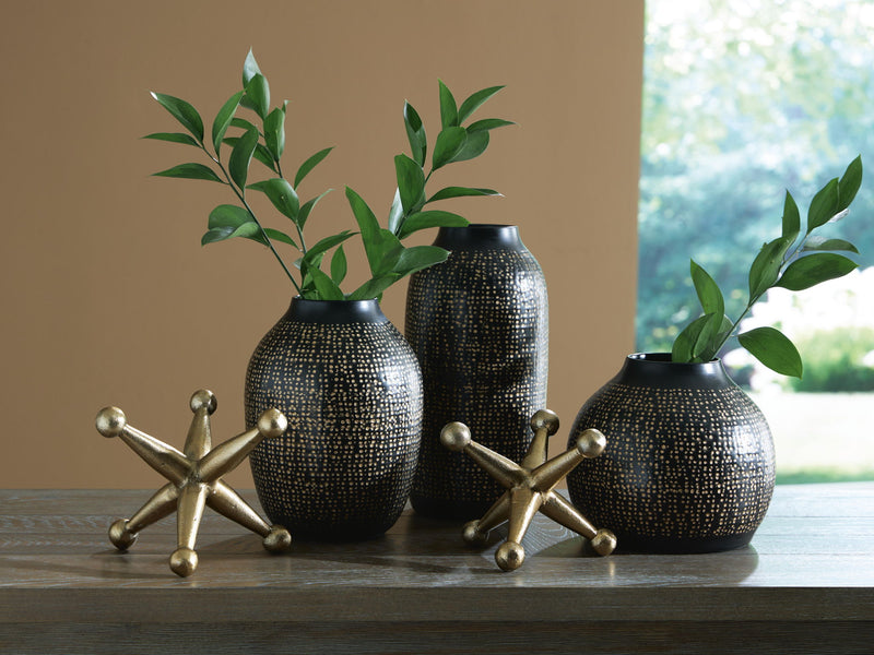 Signature Design by Ashley Vinburn accessory set with five stylish table accessories arranged on a wooden surface.