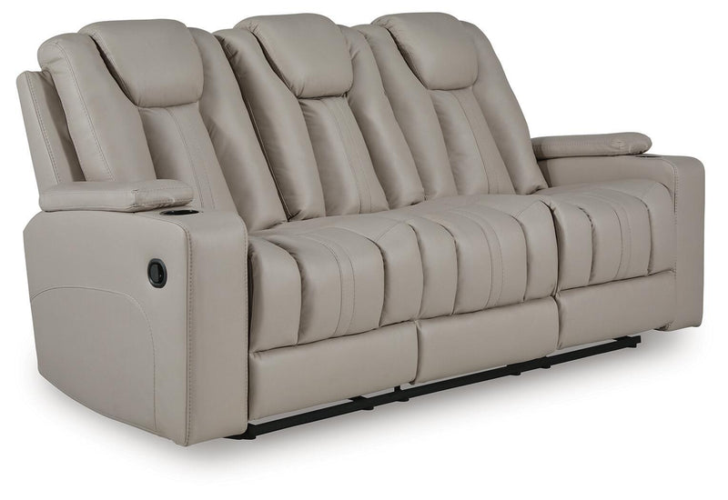 Signature Design by Ashley Elevate Edges reclining sofa with drop-down table in coin fabric, showcasing plush cushions and armrest.