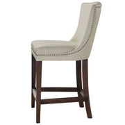 White Dariela counter stool by Uttermost with a sleek design and wooden legs, suitable for kitchen or bar area.