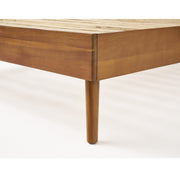Noble House Okioki mid-century natural stained solid acacia wood platform bed shown in a modern bedroom setting.