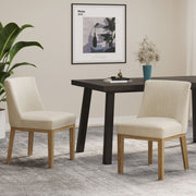 Set of two Noble House modern dining chairs with durable fabric upholstery and sturdy wooden frames.