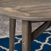 Outdoor acacia wood bar table with slat top by Noble House, featuring a sturdy design for outdoor dining and entertaining.