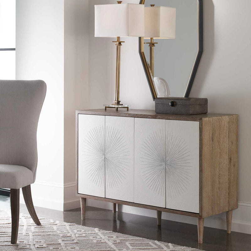 Uttermost Dani 4-door white accent cabinet with sleek design and modern hardware, showcasing its elegant storage solution.