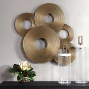Gold rings wall decor by Uttermost, featuring a modern metallic design for stylish interior decoration.