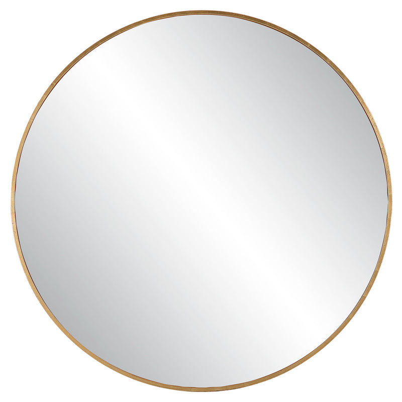 Uttermost Junius round wall mirror with a sleek metal frame, hanging on a neutral wall for modern home decor.