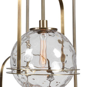 Uttermost Mimas 3-light gold pendant lighting fixture hanging with glass shades and modern design.