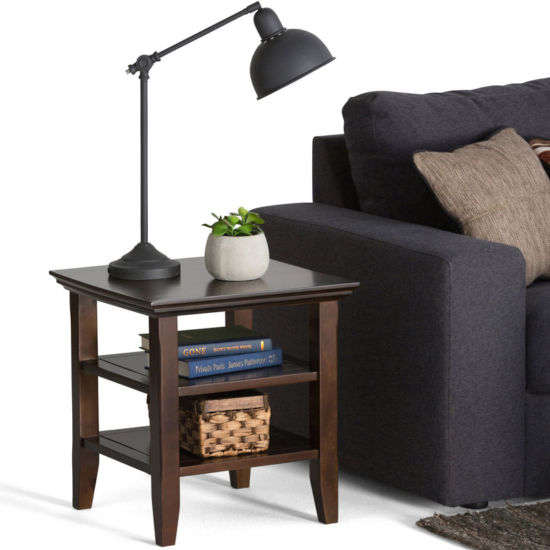 Handcrafted Acadian end table by Simpli-Home featuring a rustic wooden surface and sturdy legs in a cozy living space.