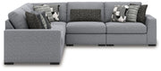 Benchcraft Bealton stationary sectional with plush fabric upholstery and modern design, shown in a spacious living room setting.
