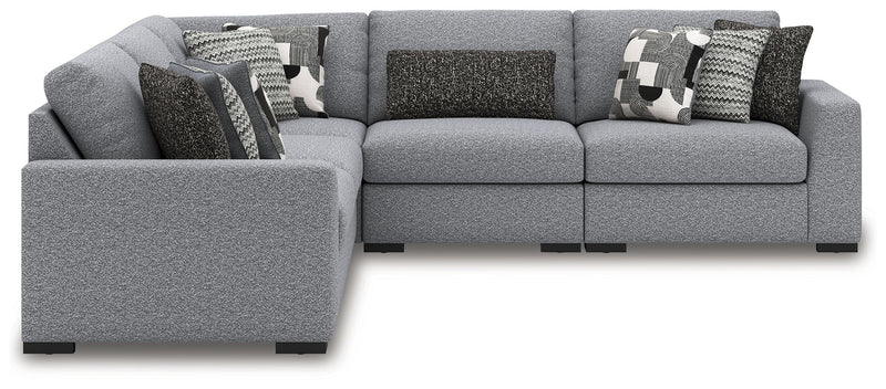 Benchcraft Bealton stationary sectional with plush fabric upholstery and modern design, shown in a spacious living room setting.