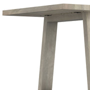 Simpli-Home Whitley dining table with wooden surface and sturdy legs, ideal for modern dining rooms.