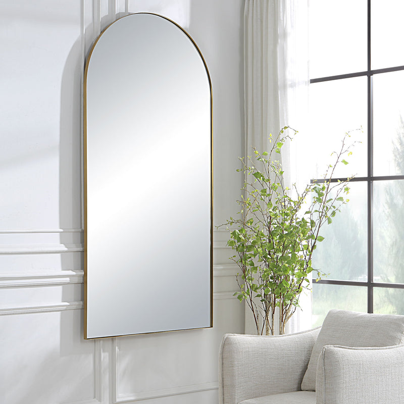 Uttermost Crosley Arch Mirror with antique brass finish, wall-mounted decorative mirror with elegant curved design.