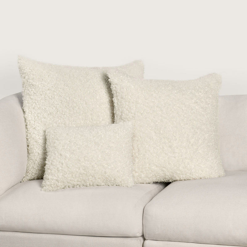 Ivory Carters accent pillow measuring 22x22 inches by Classic Home, with soft fabric and decorative design for living room decor.