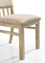 Set of two Lilola Home Brutus wide dining chairs with reclaimed wheat finish, showcasing sturdy wooden seats and supportive backs.
