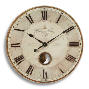 Uttermost Harrison Gray wall clock with a modern round design and stylish gray finish, showcasing a sleek clock face and minimalist hands.