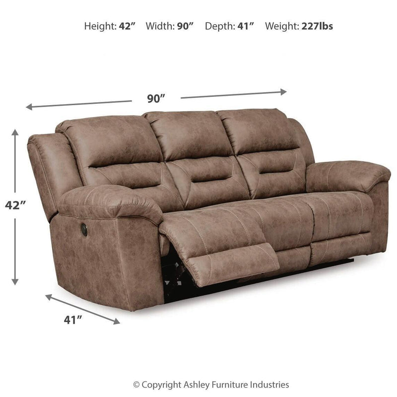 Signature Design by Ashley® Stoneland power reclining sofa with plush cushions and reclining features in a modern living room setting.