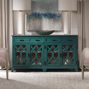 Oksana wooden credenza by Uttermost with a green finish, featuring sleek design and storage drawers, ideal for modern living spaces.
