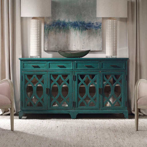 Oksana wooden credenza by Uttermost with a green finish, featuring sleek design and storage drawers, ideal for modern living spaces.