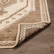 Hand-knotted Luxor area rug by Classic Home featuring intricate patterns and rich colors, perfect for adding elegance to any space.