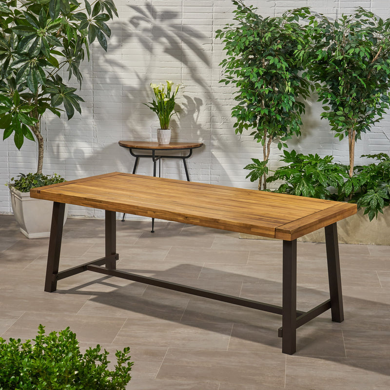Noble House Equilibrium outdoor dining table with wooden frame and slat top, perfect for patio or garden dining spaces.