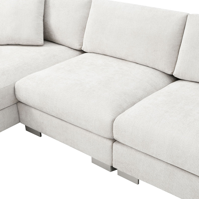 Luxe & Co. modern cloud L-shaped sectional sofa with oversized chaise, four seats, and two decorative pillows in a stylish living room setting