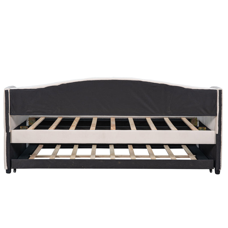 DreamHaus upholstered daybed sofa bed with trundle and wood slat base, showcasing its stylish design and functional sleeping space.