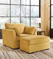Living room set featuring a stationary chair and ottoman by Signature Design Ashley, with plush upholstery and modern design.