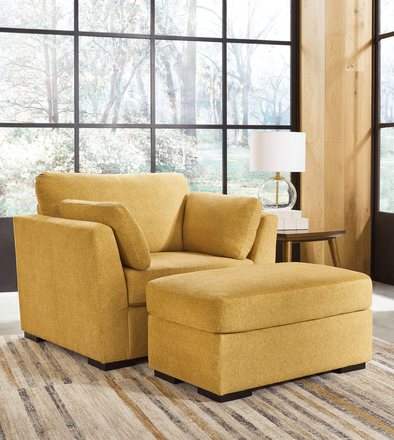 Living room set featuring a stationary chair and ottoman by Signature Design Ashley, with plush upholstery and modern design.