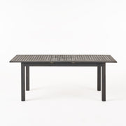 Outdoor expandable Noble House dining table with square legs, featuring a spacious surface and modern design for outdoor dining.