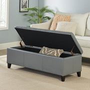 Noble House Glouster contemporary storage ottoman with plush fabric and wooden legs, serving as a stylish seating and storage solution.