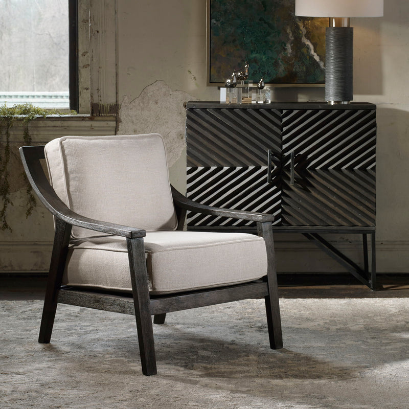 Uttermost Lyle beige accent arm chair with plush upholstery and curved wooden legs for stylish seating.