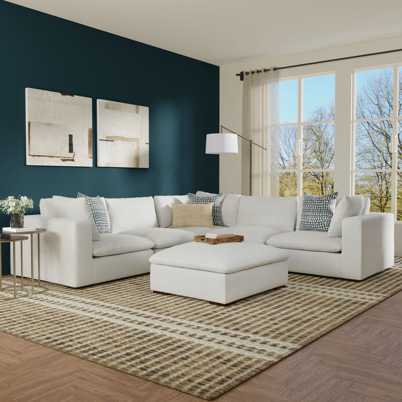 Simpli-Home Jasmine handcrafted sofa and ottoman set in a modern living room with neutral fabric and decorative cushions.