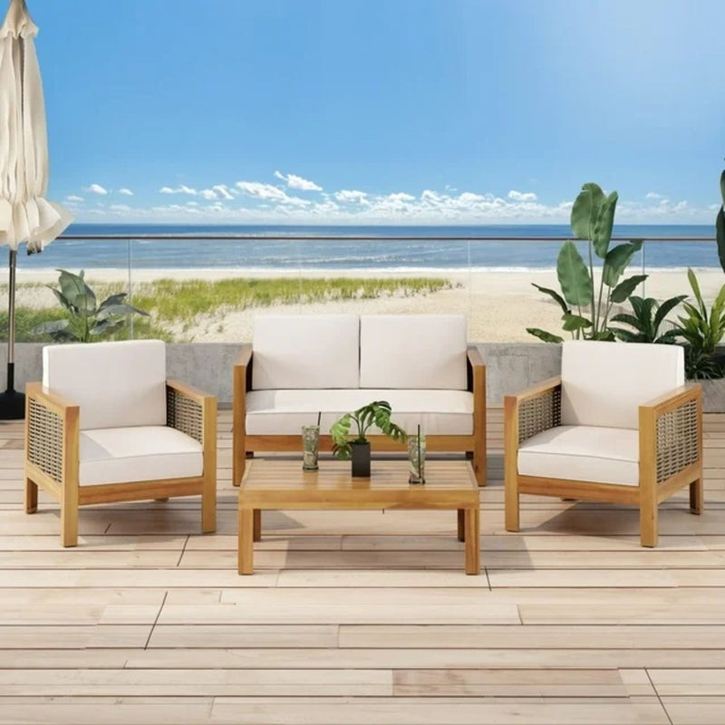 Outdoor 4-seater acacia wood chat set with wicker accents and beige cushions, featuring teak finish and mixed brown tones.