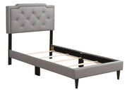 Button tufted upholstered bed by Glory Furniture with plush fabric and cozy design, perfect for relaxing bedroom spaces.