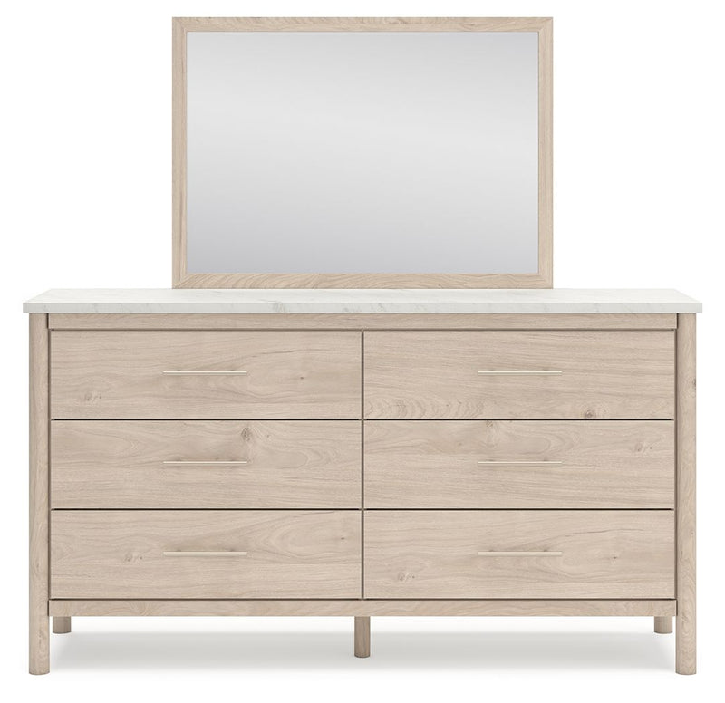 Signature Design by Ashley Cadmori six drawer dresser with a dark wood finish and modern hardware, showing the front view.