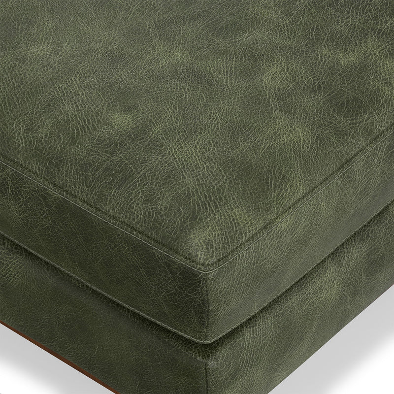 Simpli-Home Morrison handcrafted upholstered ottoman with soft fabric and wooden legs, used as a footrest or accent piece.