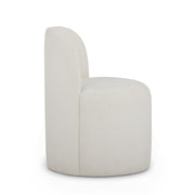 TOV Furniture Persa dining side chair with a sleek design, wooden legs, and a cushioned upholstered seat and back.