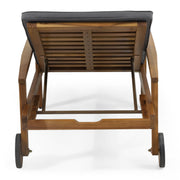 Noble House Jason adjustable acacia wood outdoor chaise lounge with cushions, ideal for relaxing in the backyard or patio.