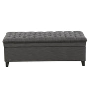 Noble House Juliana storage ottoman with beige fabric and birch wood legs, featuring a cushioned top and interior storage space.