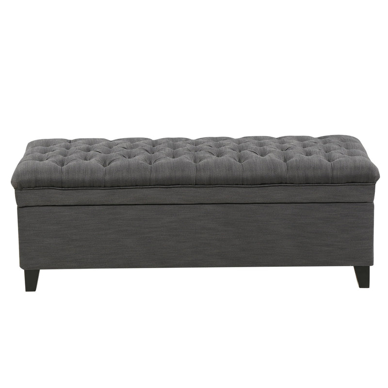 Noble House Juliana storage ottoman with beige fabric and birch wood legs, featuring a cushioned top and interior storage space.